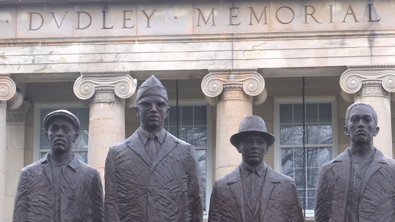 A statue of the Greensboro Four.